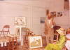 1985 photograph of Samuel Oppenheim conducting a class, with Girl in Pink, unfinished on easel.